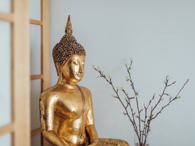 Goldener Buddah im Wellnessbereich des Hotel Gstaaderhof